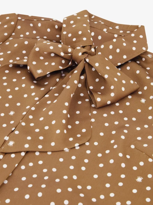 Blouse met stippen en strikkoord