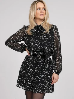 Gestippelde jurk met strik detail