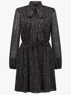 Gestippelde jurk met strik detail